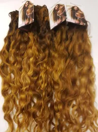 Curly golden brown blond hand tied weave